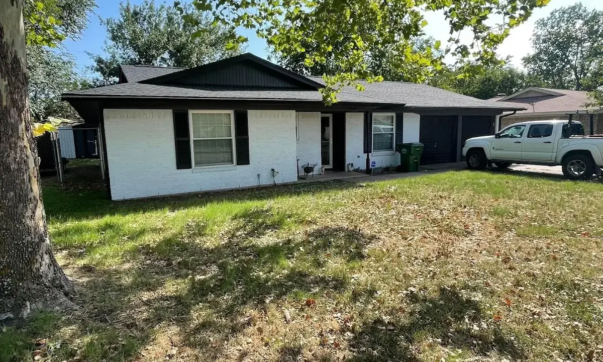 Professional roofing crew working on a residential roof in Willmar